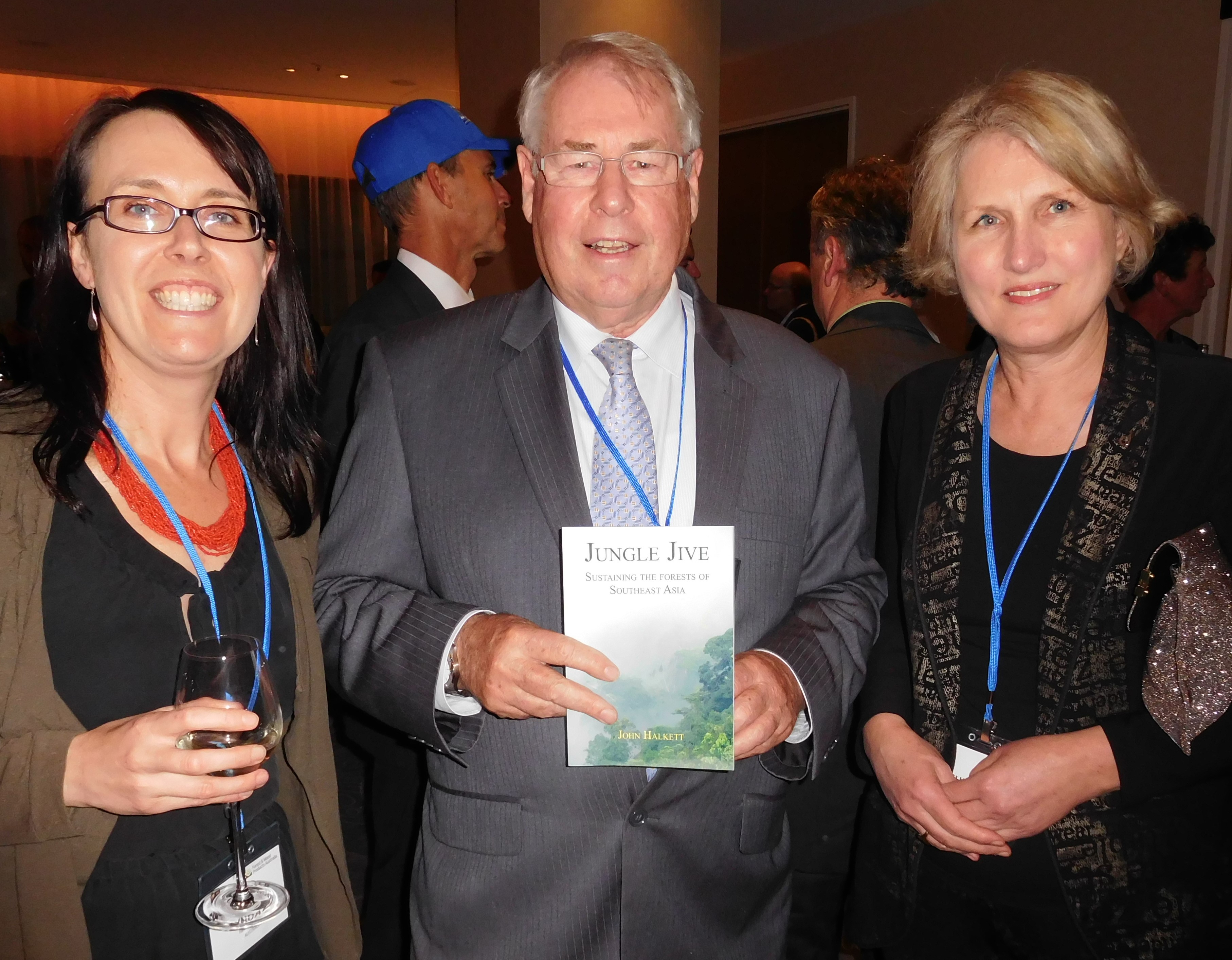 Dr Lyndall Bull, director, Forestry Tasmania, and Cr Christine Sindt, Latrobe City, Victoria, congratulate John Halkett at the book launch at the Melbourne Outlook and Insights Conference.